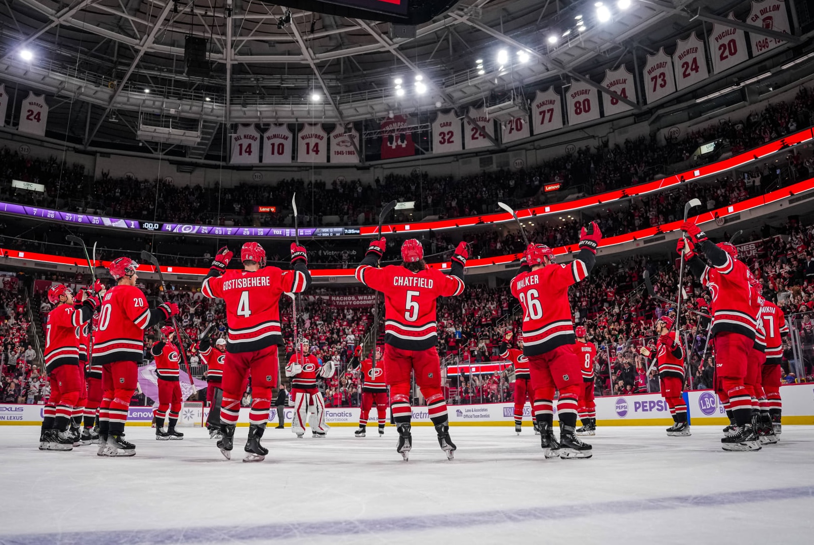 Canes players gathering on the ice for a Storm Surge.
